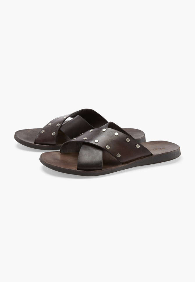 Cross-over studded sandals