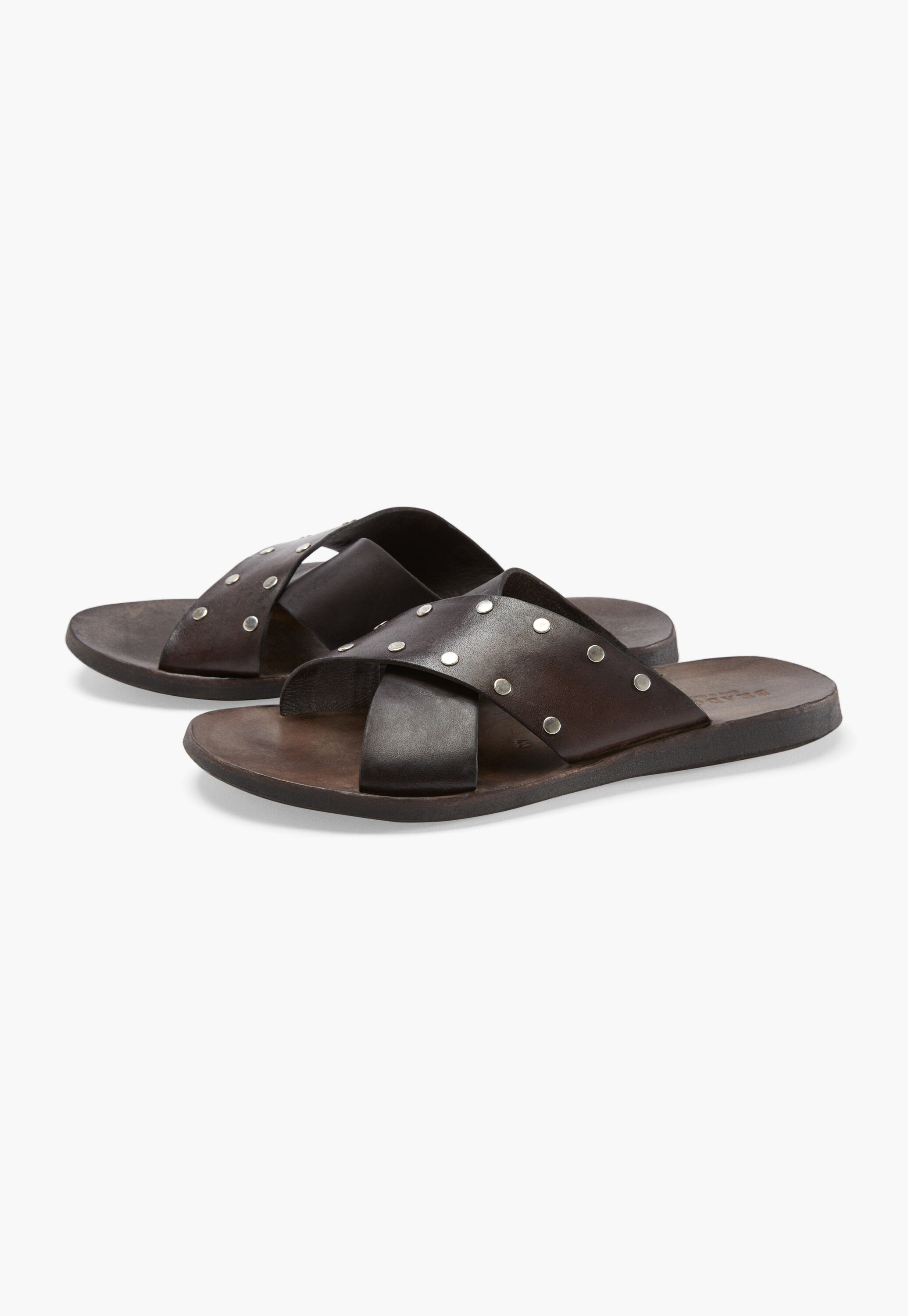 Cross-over studded sandals