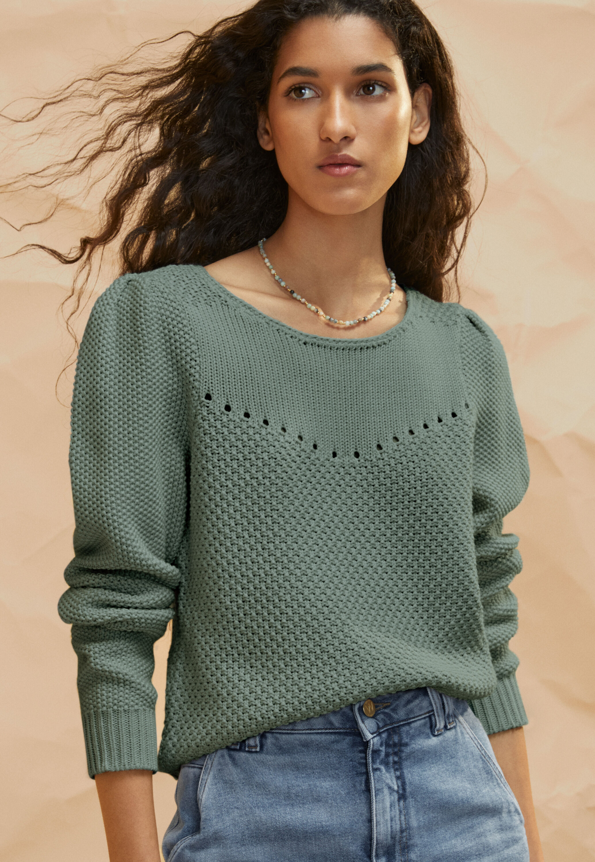Stitch-mixing pointelle sweater