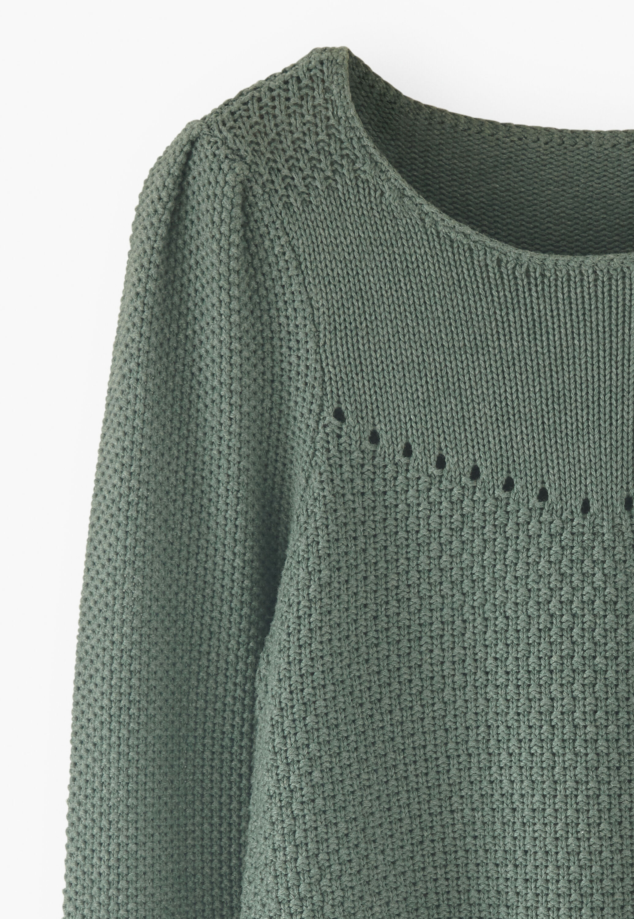 Stitch-mixing pointelle sweater
