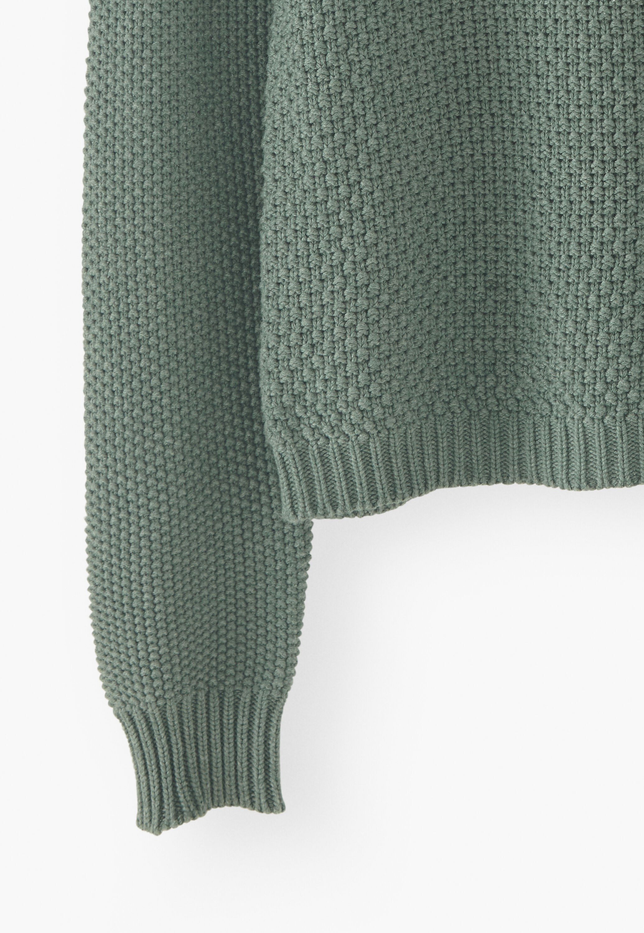 Stitch-mixing pointelle sweater